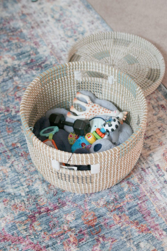 A lidded basket to hide away baby toys