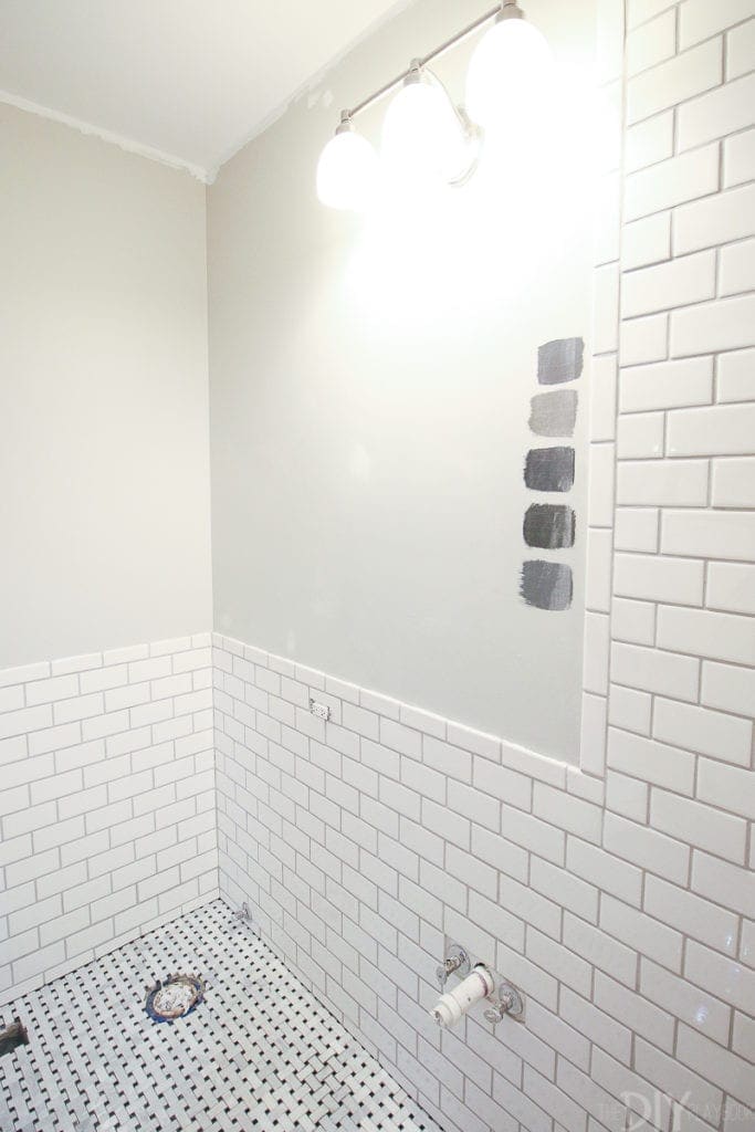 We used white subway tile halfway up the wall in the bathroom