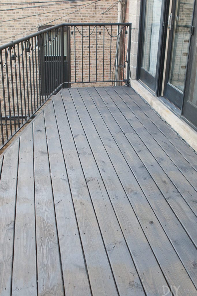 One coat of stain on the deck in the color harbor mist