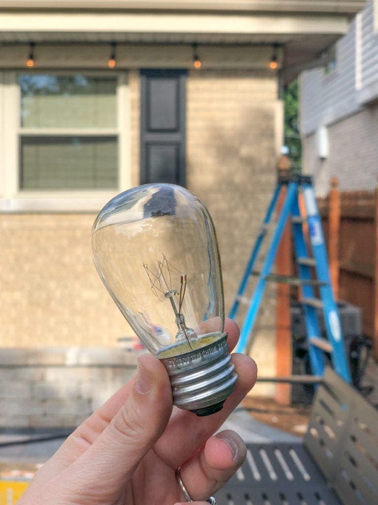 adding string lights to a patio
