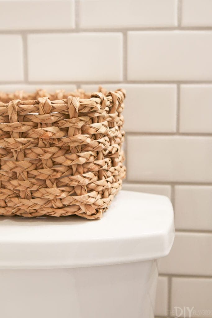 Keep extra toilet paper handy with a textured basket