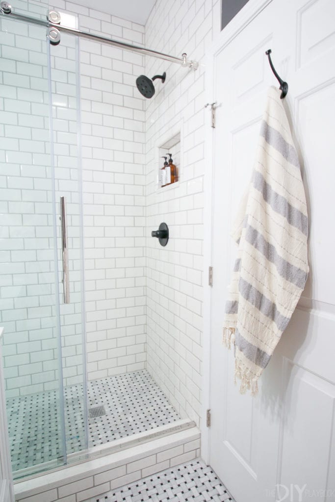Subway tile shower in a small bathroom