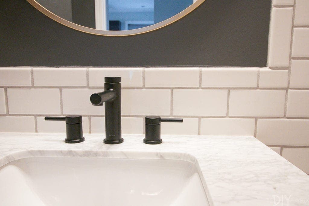 You don't always have to use the backsplash that comes with your bathroom vanity. This looks great without it!
