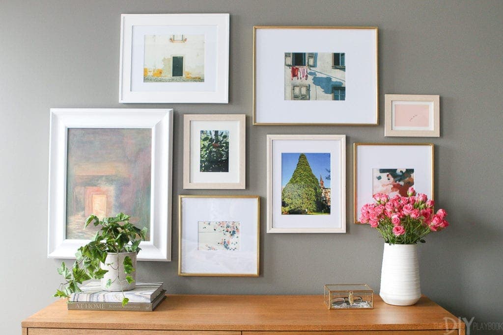 Use a mix of frames over a dresser for an eclectic look