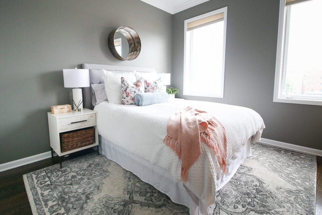 Paint color Chelsea Gray by Benjamin Moore works well in this gray guest bedroom