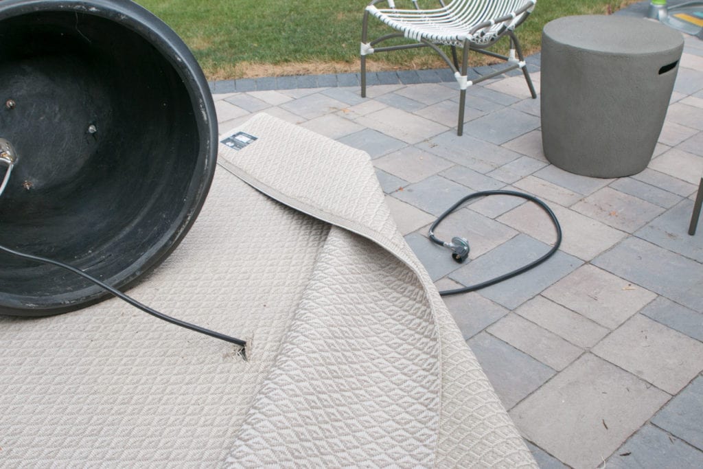 hiding a propane tank on a patio with an outdoor rug