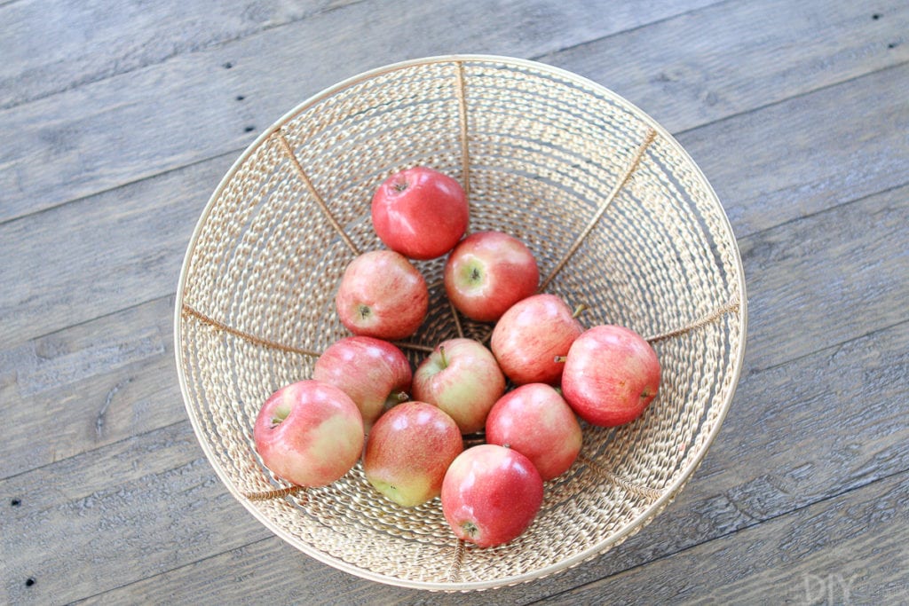 Large gold bowl with apples