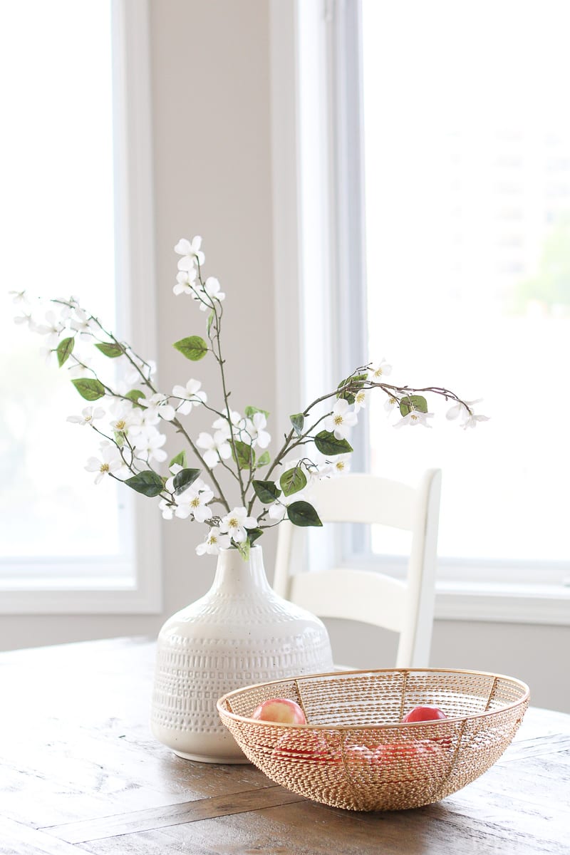 Simple vase and bowl on a dining room table