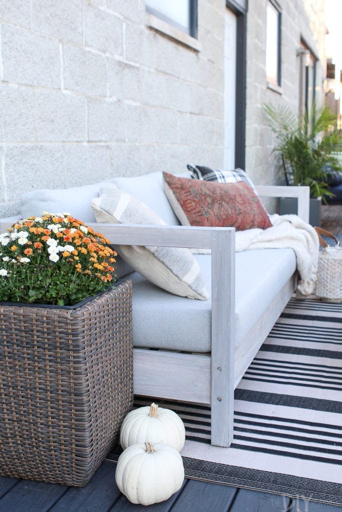 An outdoor couch with pillows