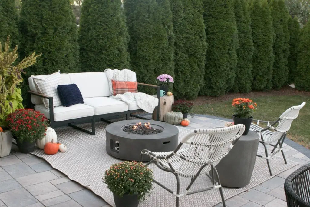 fall patio with pumpkins and mums