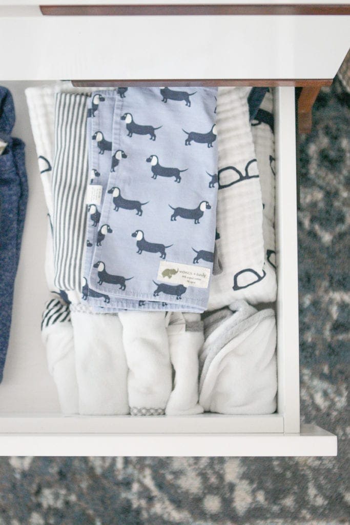 baby clothes in a dresser