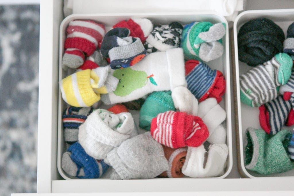 organizing socks in a drawer