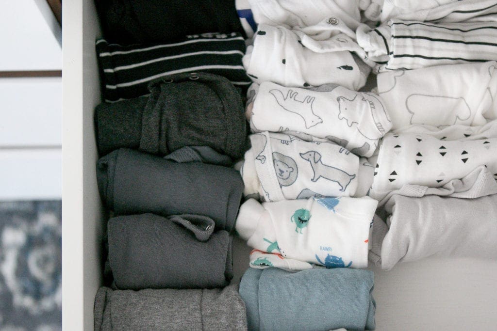 rolling clothes for easy baby clothes organizing