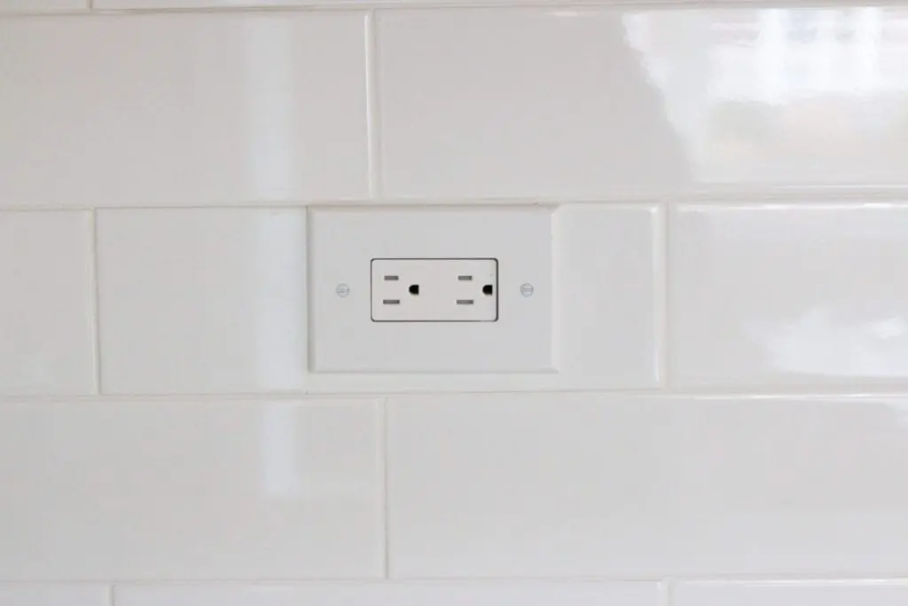 DIY backsplash tile around an outlet