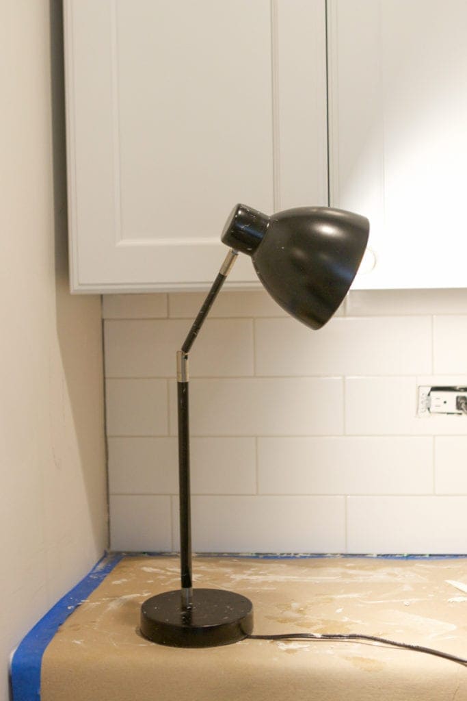 using a table lamp to grout for extra light