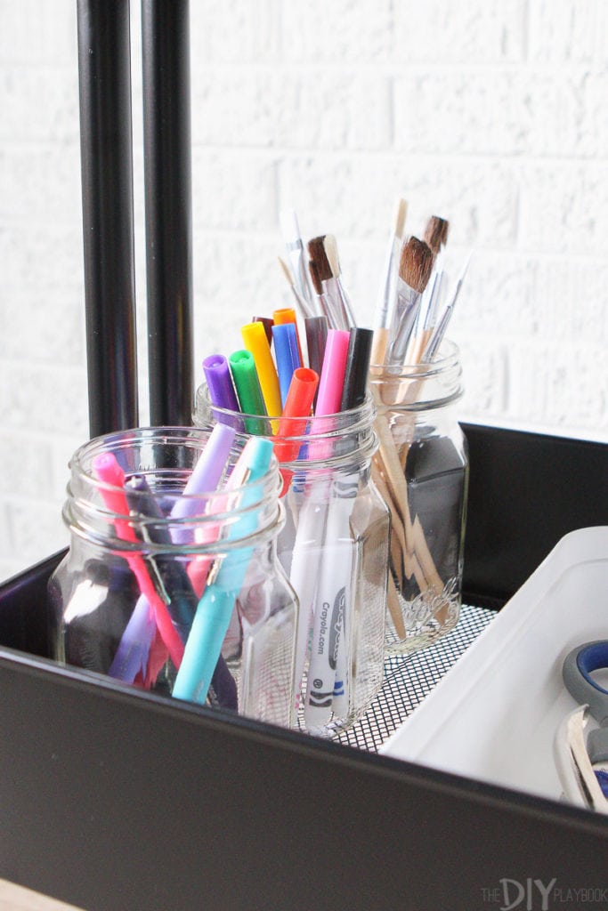 Use mason jars for colored pencils and paint brushes