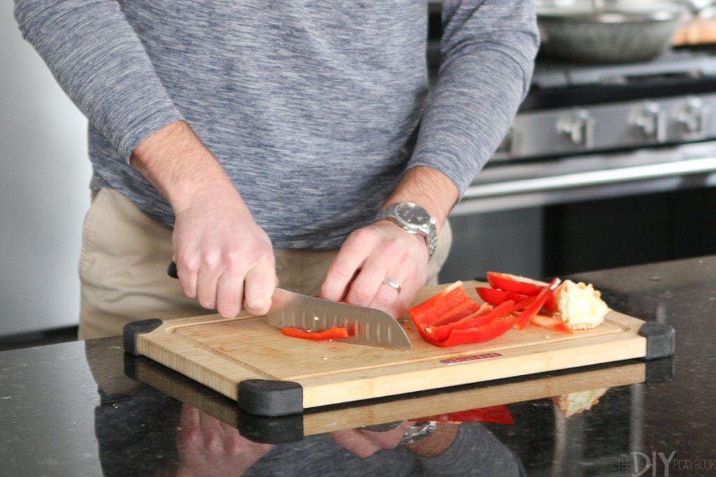 Chopping red peppers on a cutting board