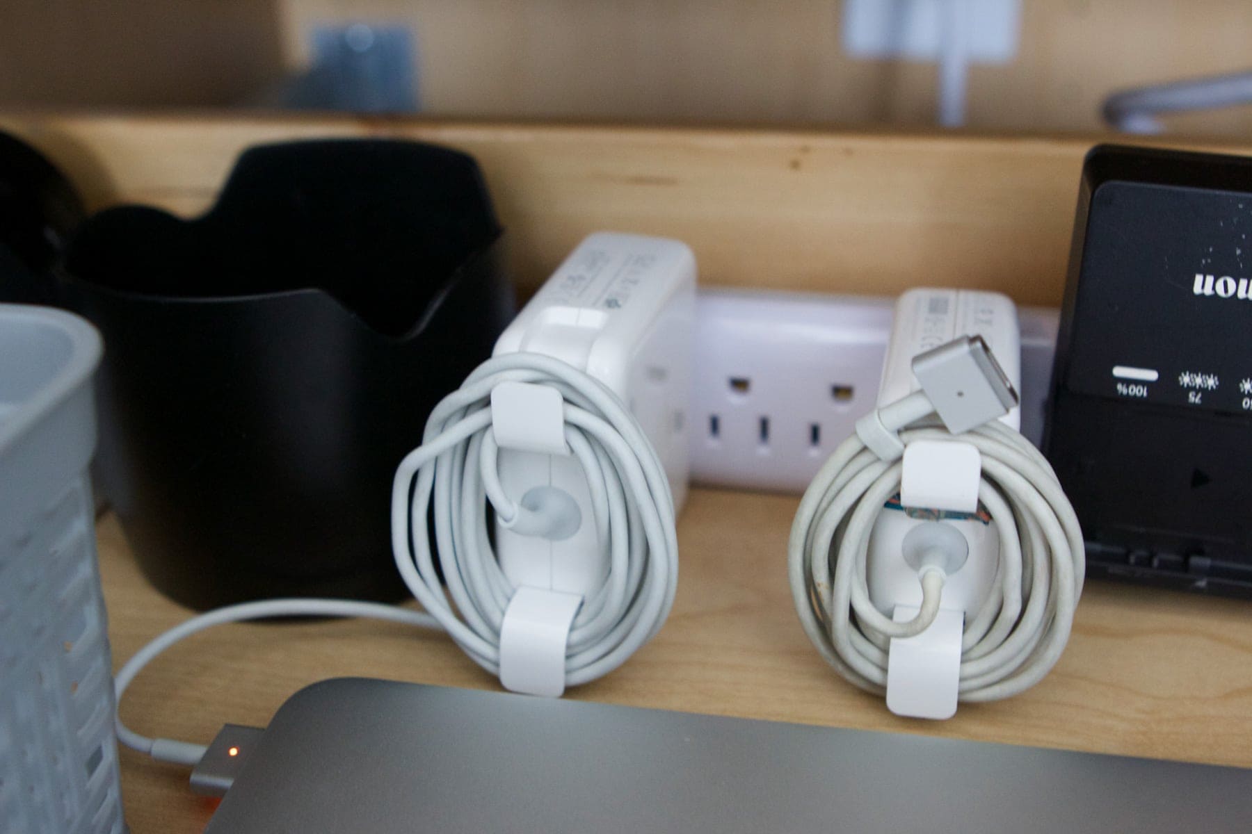 apple chargers inside of a cabinet