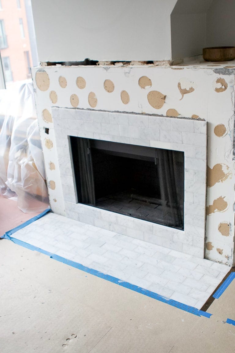Fireplace makeover with marble subway tile