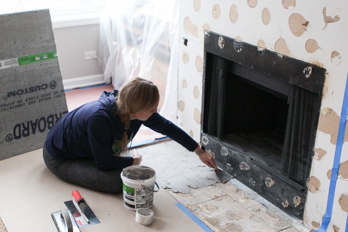 Spreading thinset on fireplace hearth
