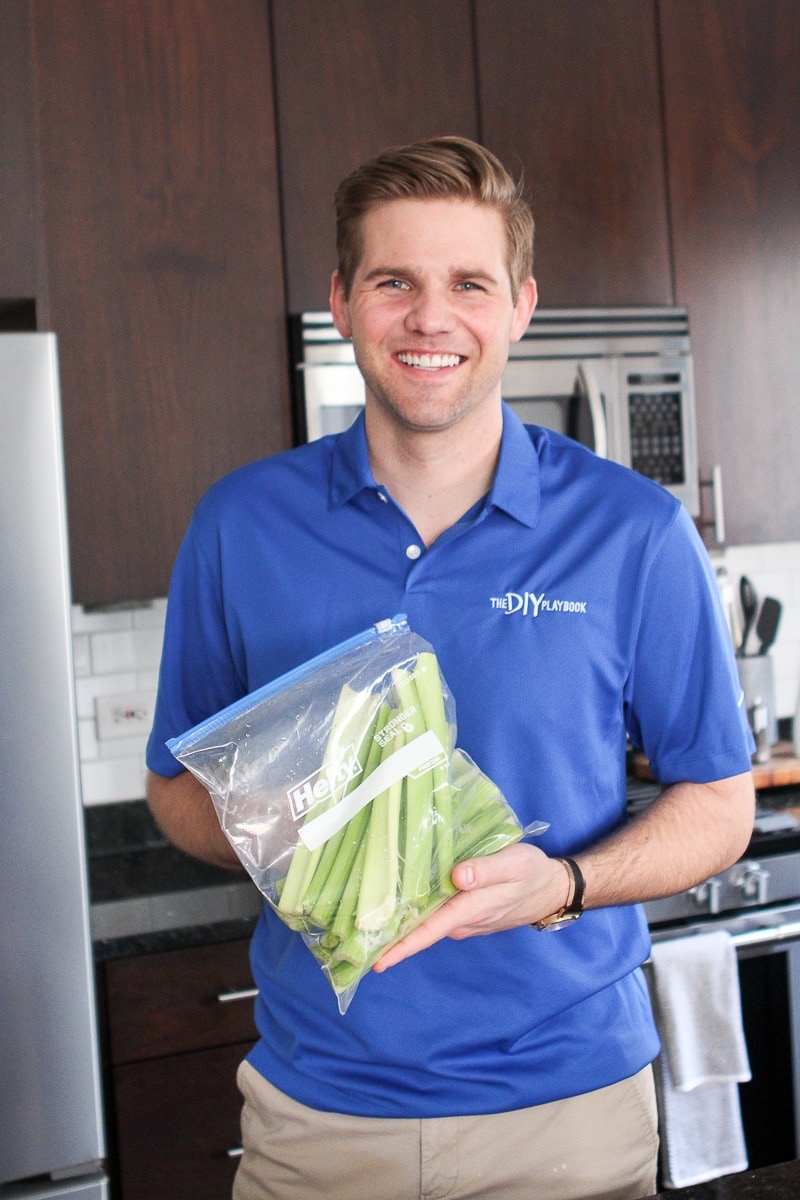 Finn holding a bag of celery stalks