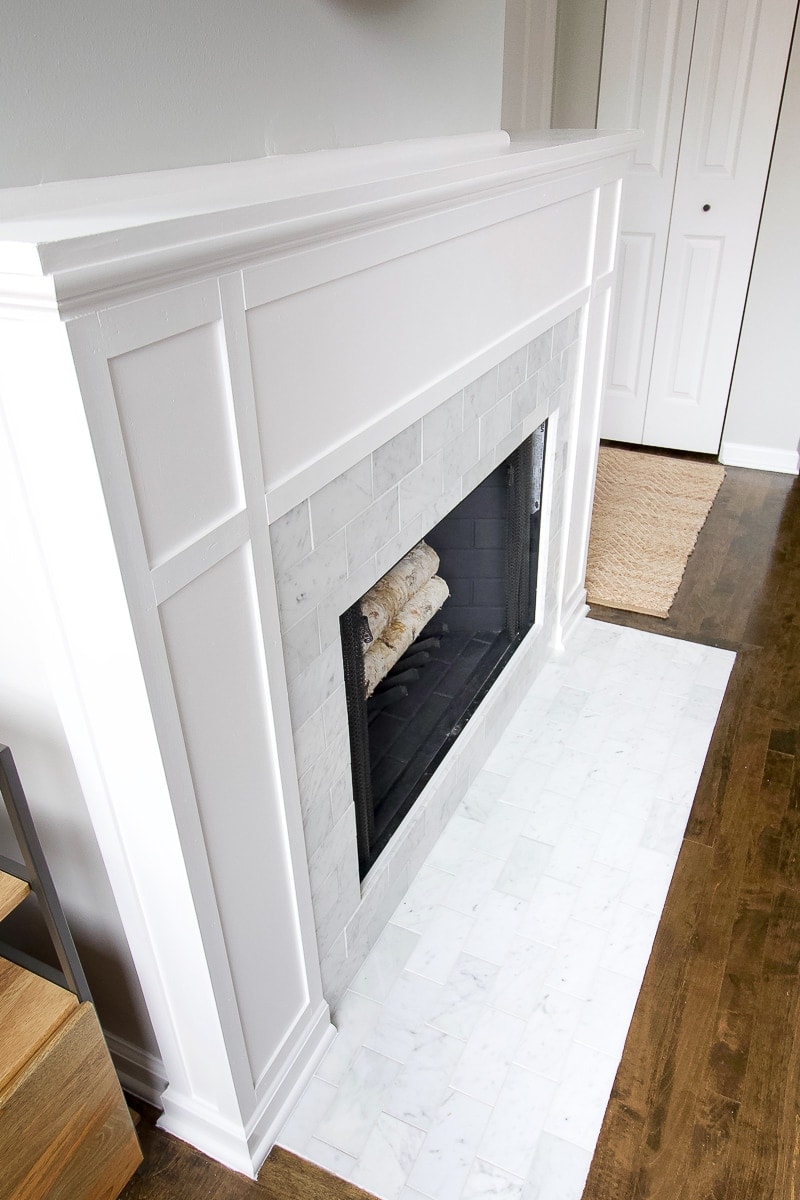 White marble tile on fireplace surround