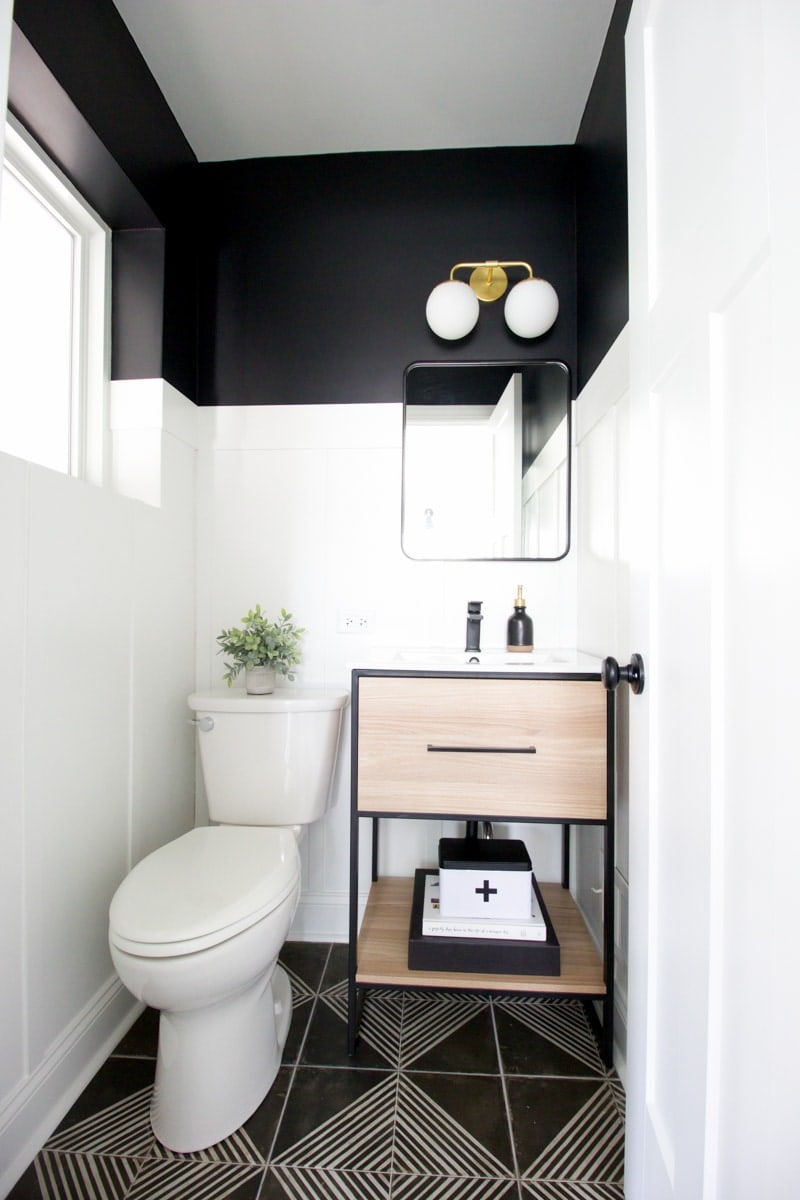 black and white bathroom with first aid box