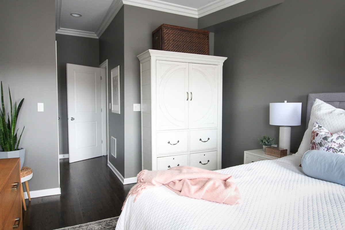 Large white hutch in a guest room