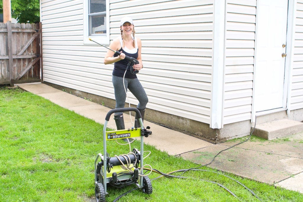 Casey power washing the house