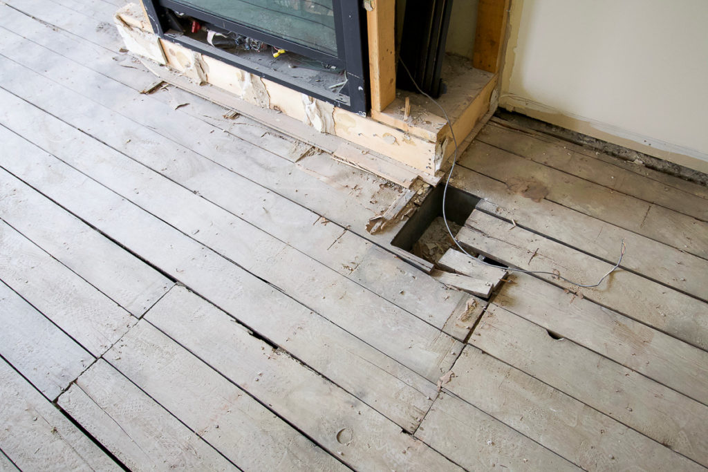 Holes in the old floorboards