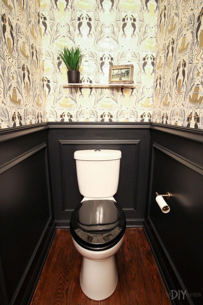 Black and gold powder room