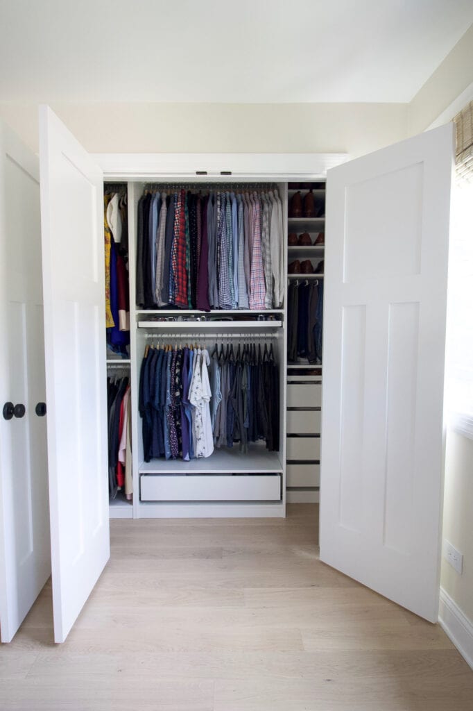 Organized men's dress shirts in a closet