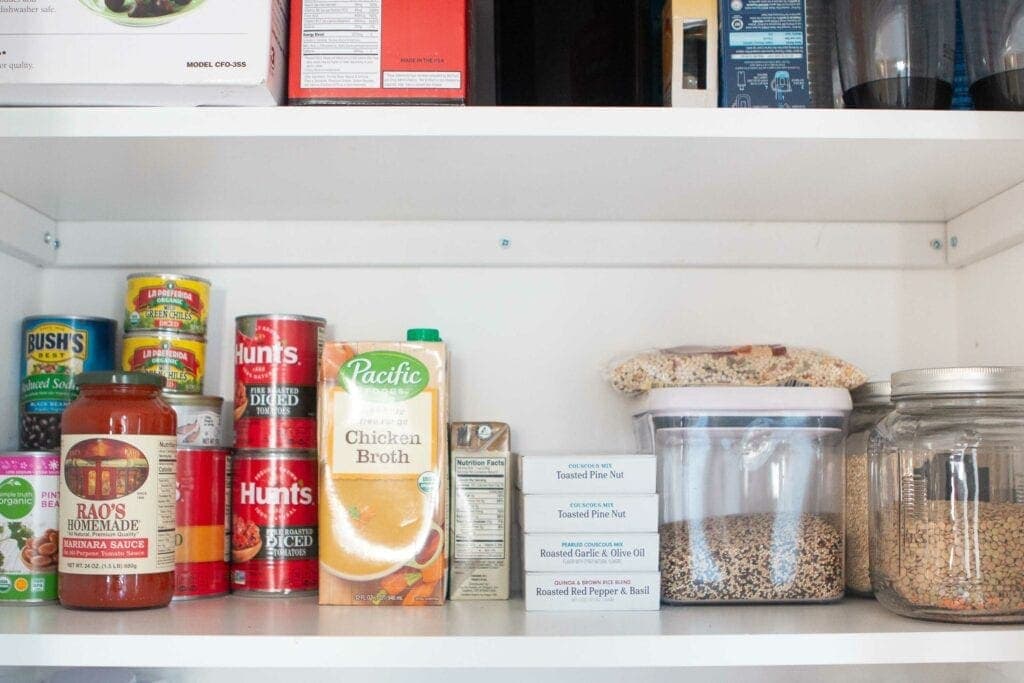 An organized pantry with DIY closet shelves
