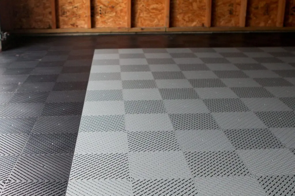 Laying garage floor tiles in a home