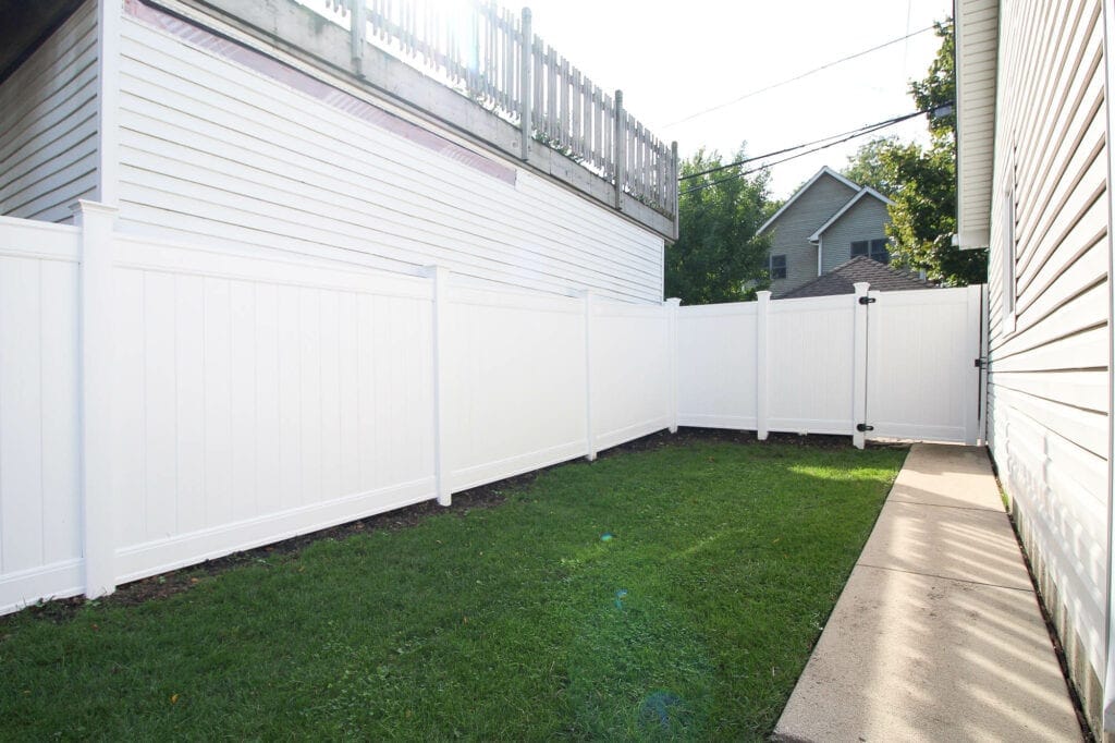 Our new white vinyl fence in the backyard