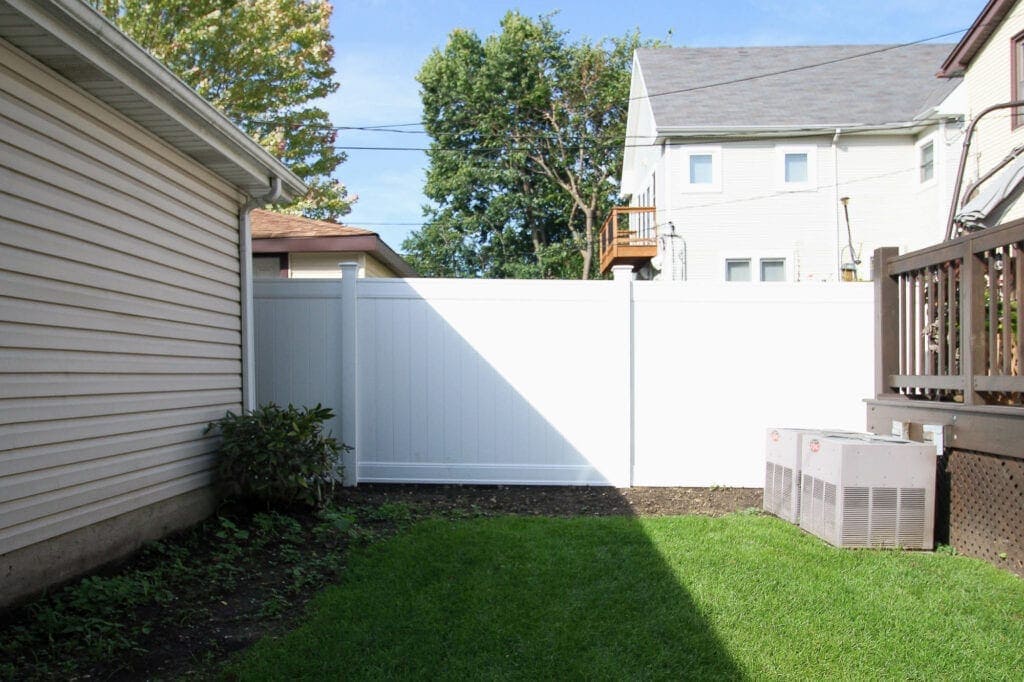 Our new white vinyl fence in the backyard