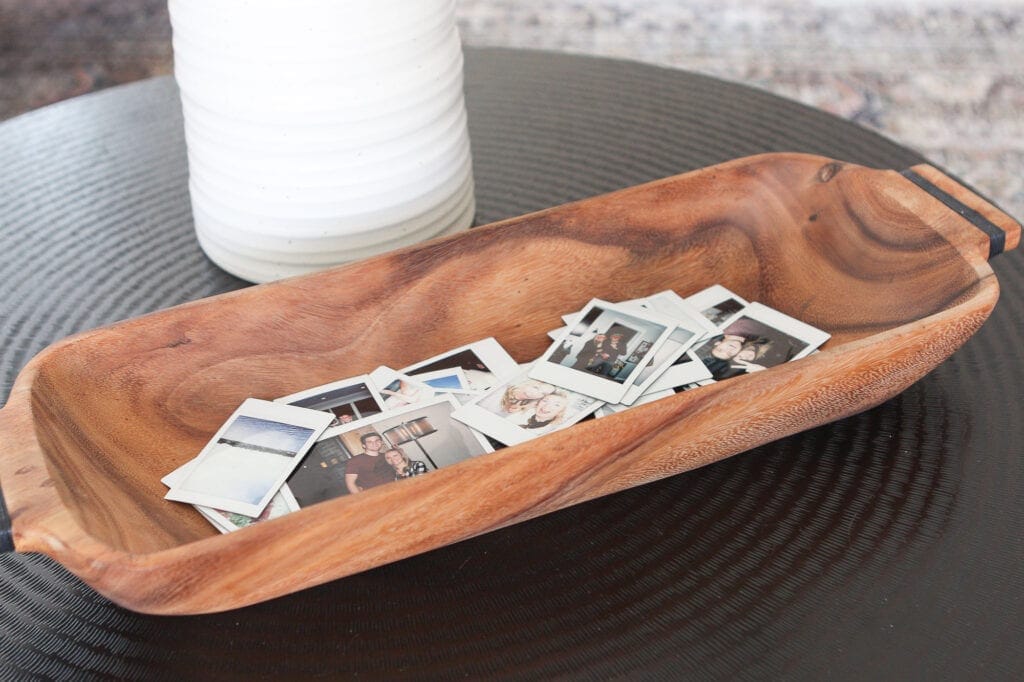 Wood bowl full of polaroid pictures