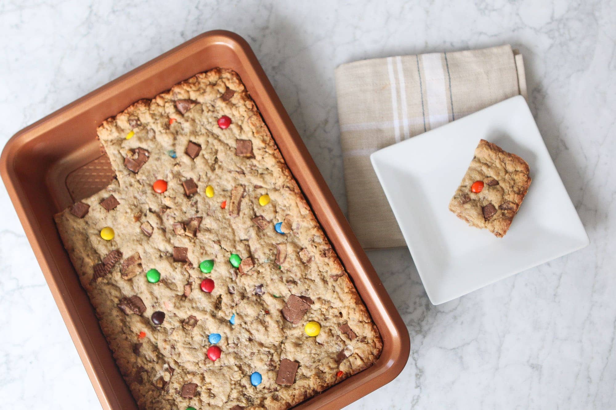 Loaded cookie bars using leftover halloween candy