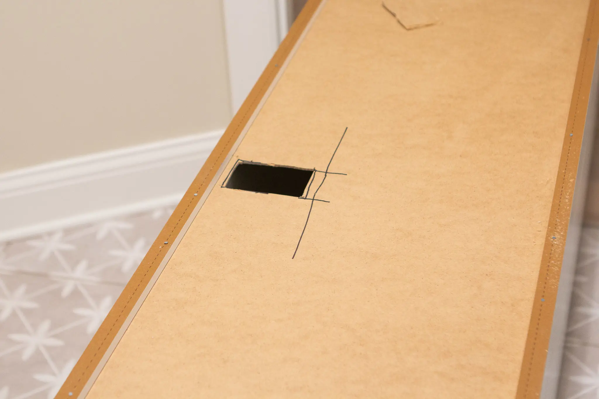 Cutting the back of IKEA kitchen cabinets for outlet