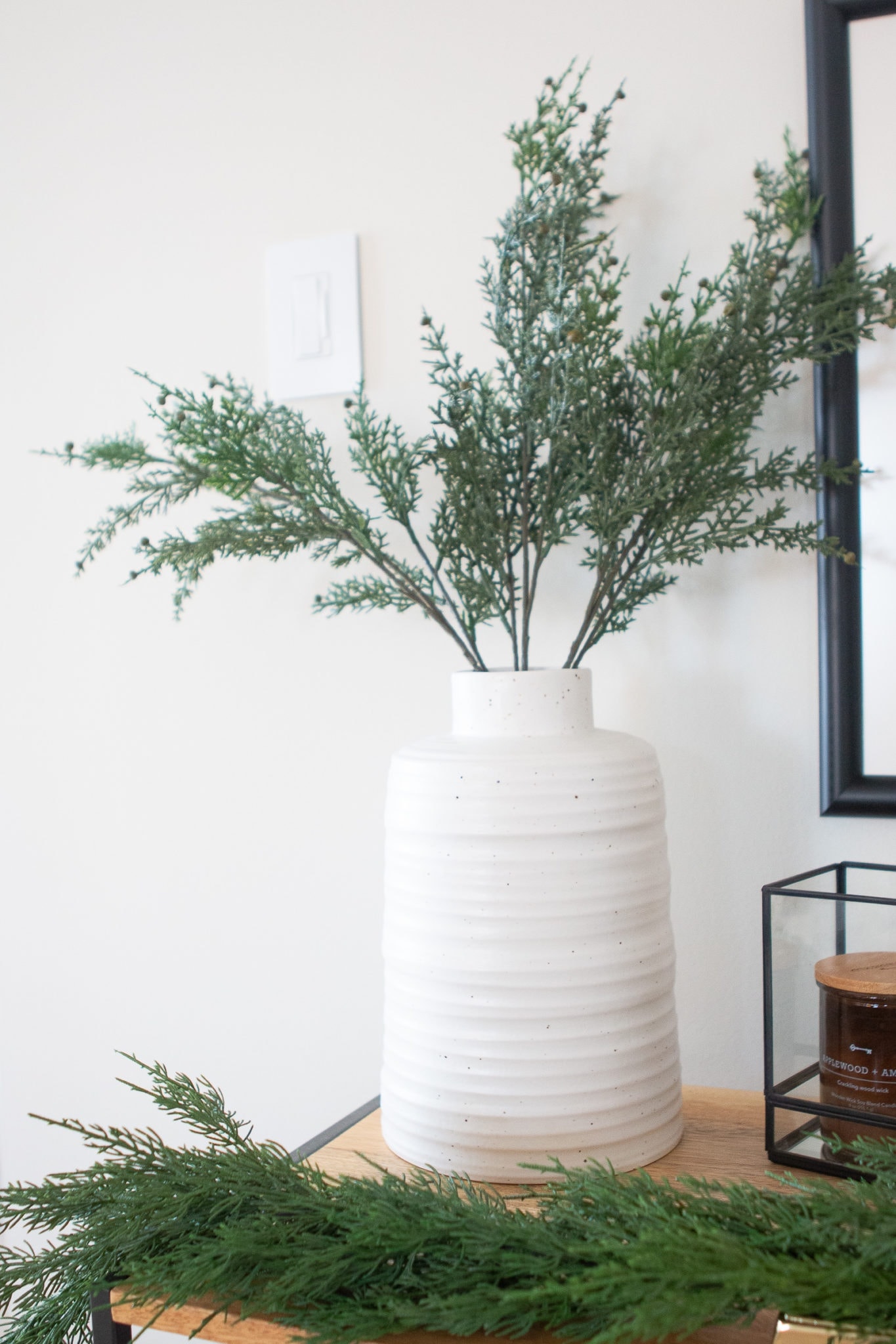 Vase with faux greenery
