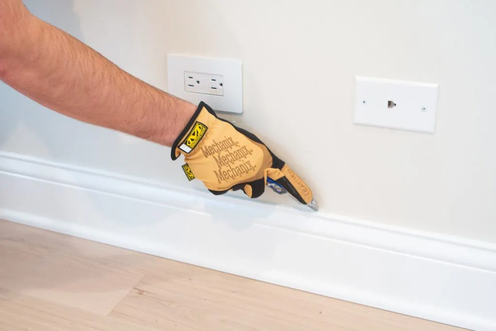 Cut the baseboard with a utility knife