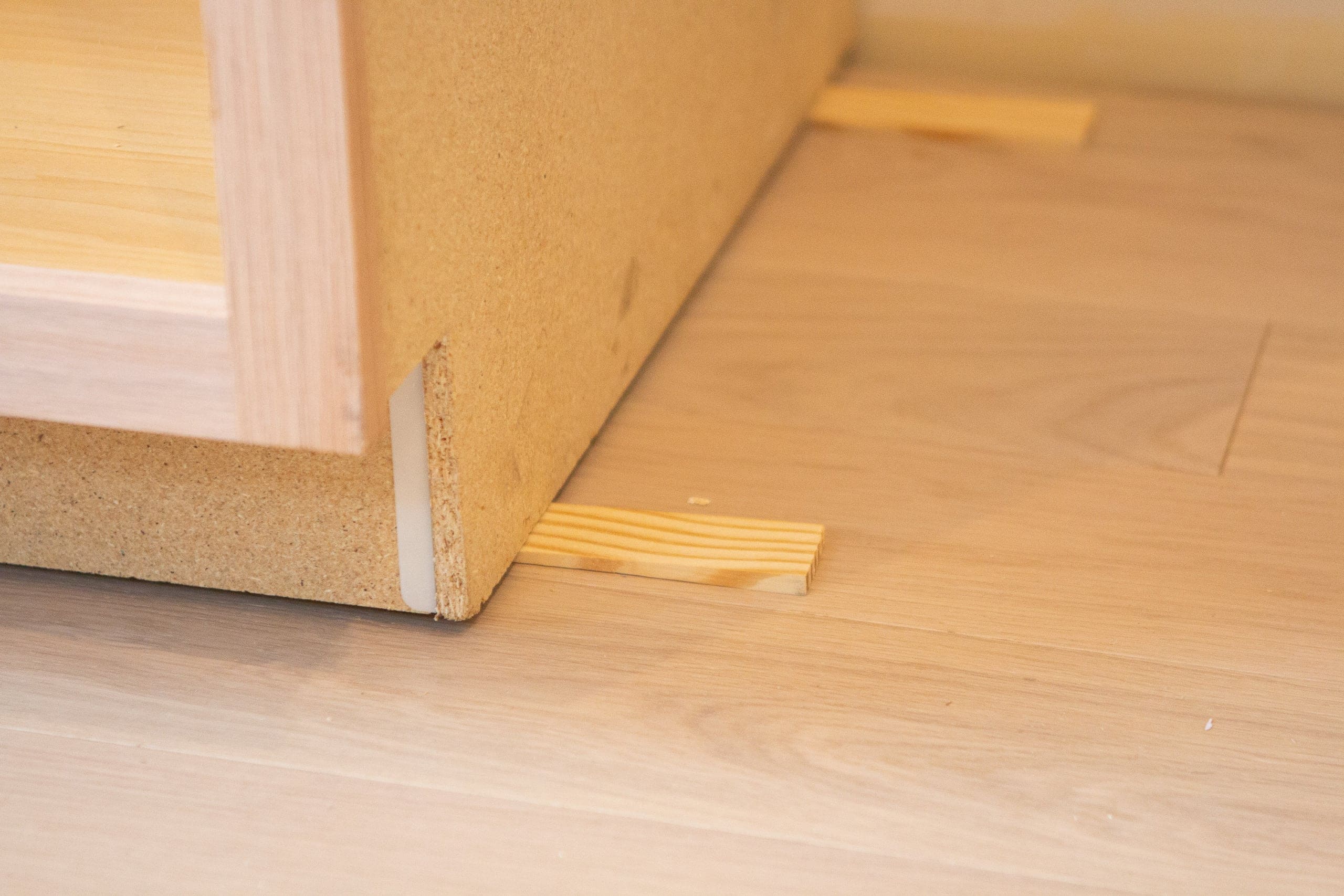 Use wood shims when installing DIY built-in cabinets