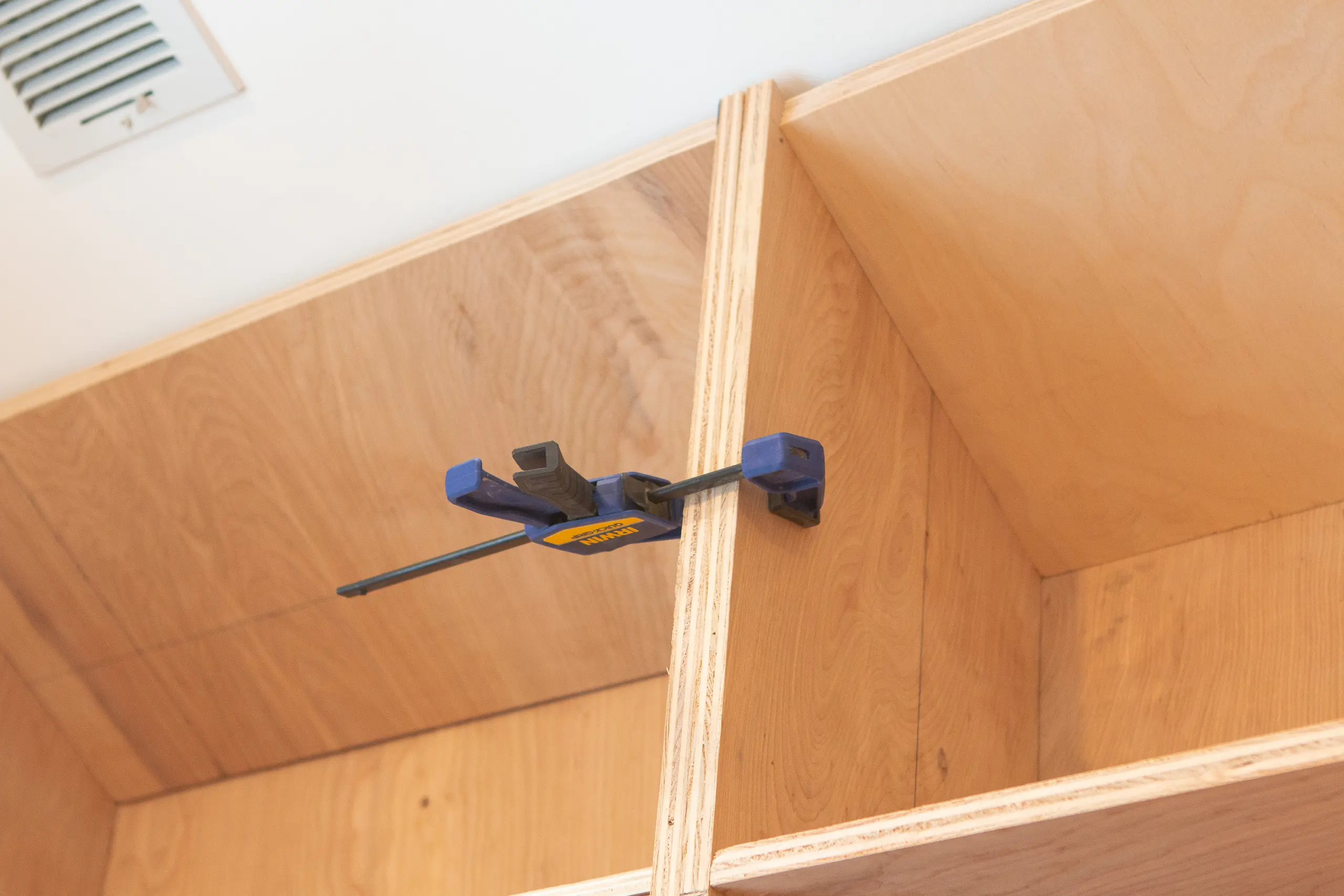 Using clamps to clamp DIY bookshelves together