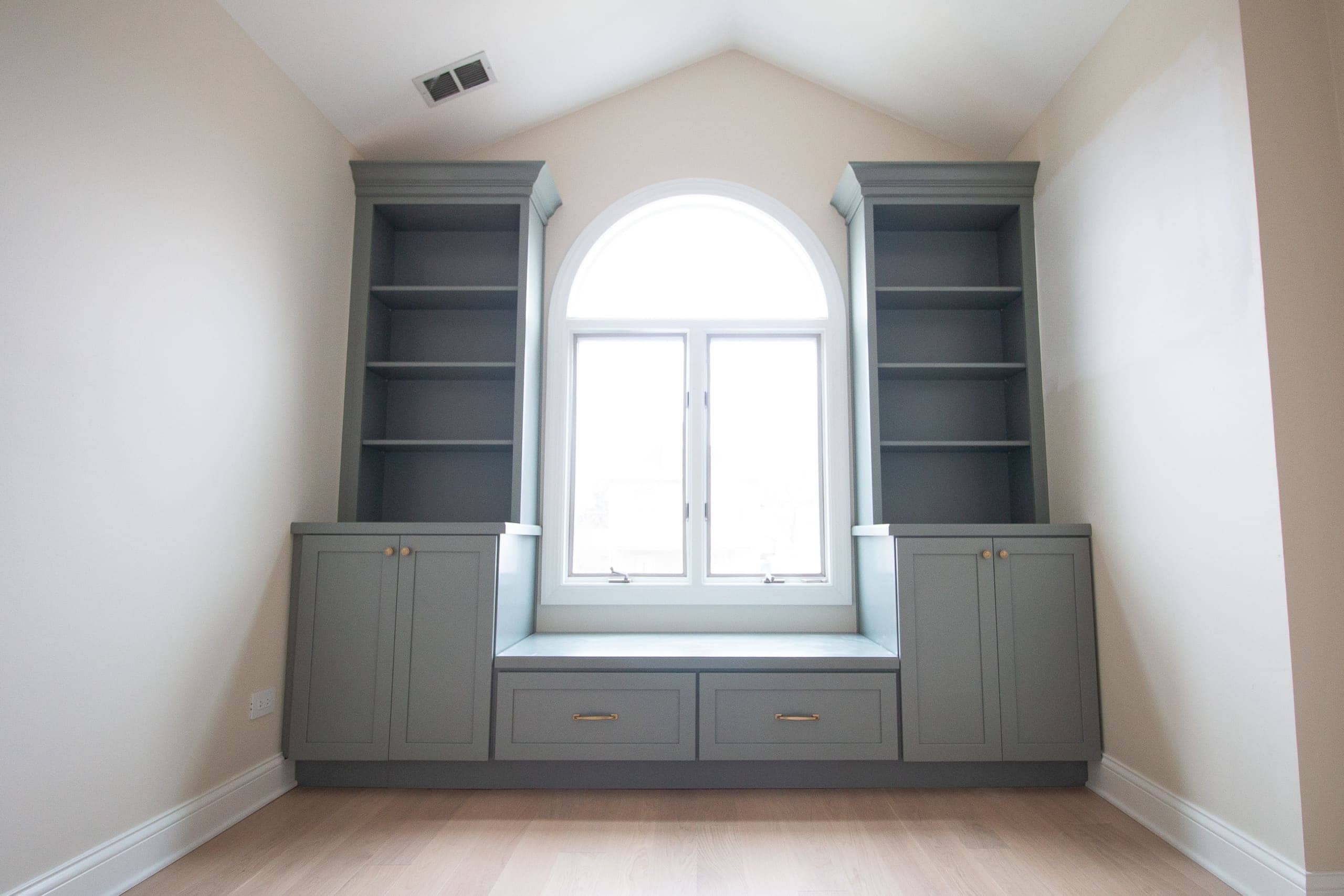 Our sage green nursery built-ins