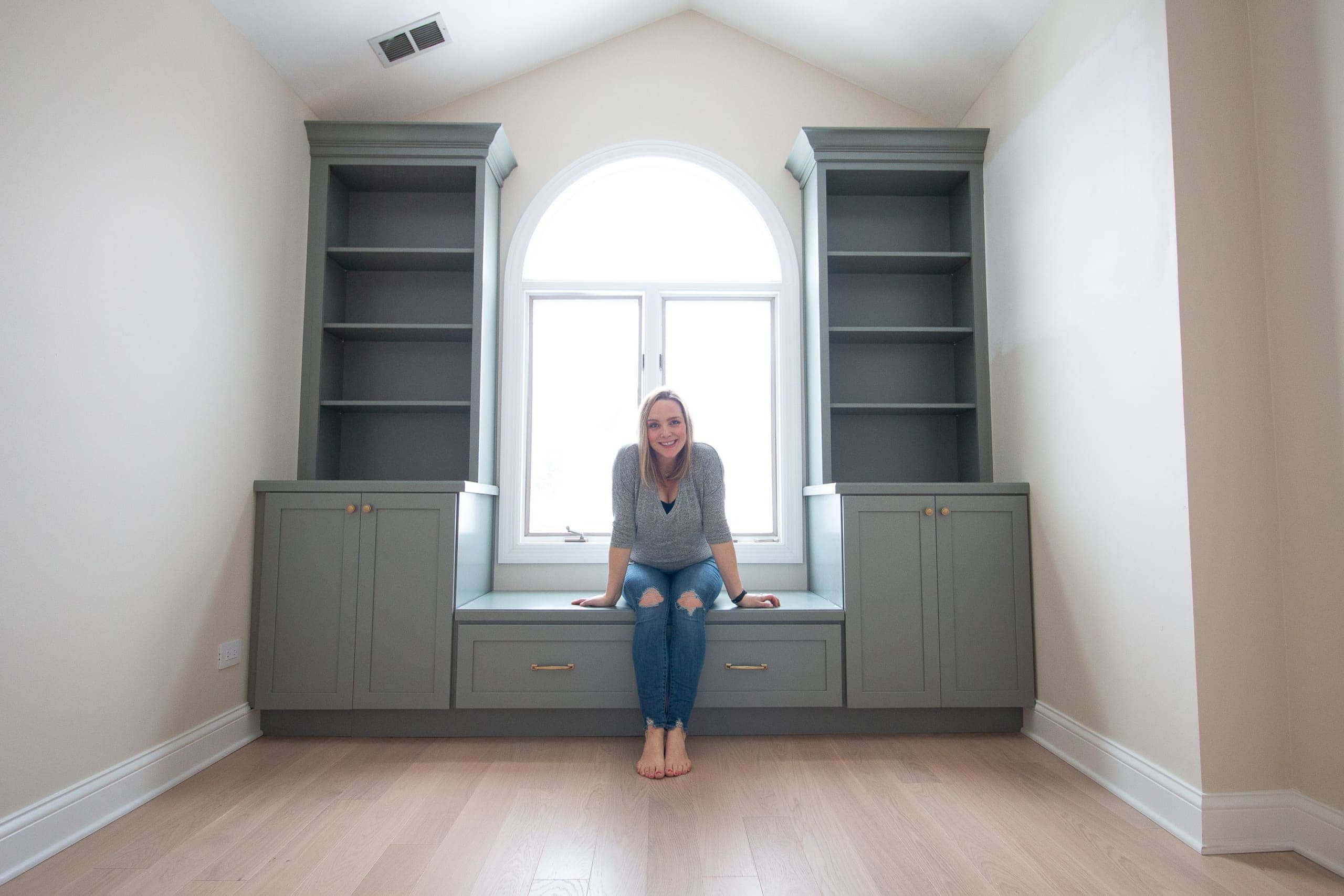Designing and installing custom nursery built-ins in the color sage green