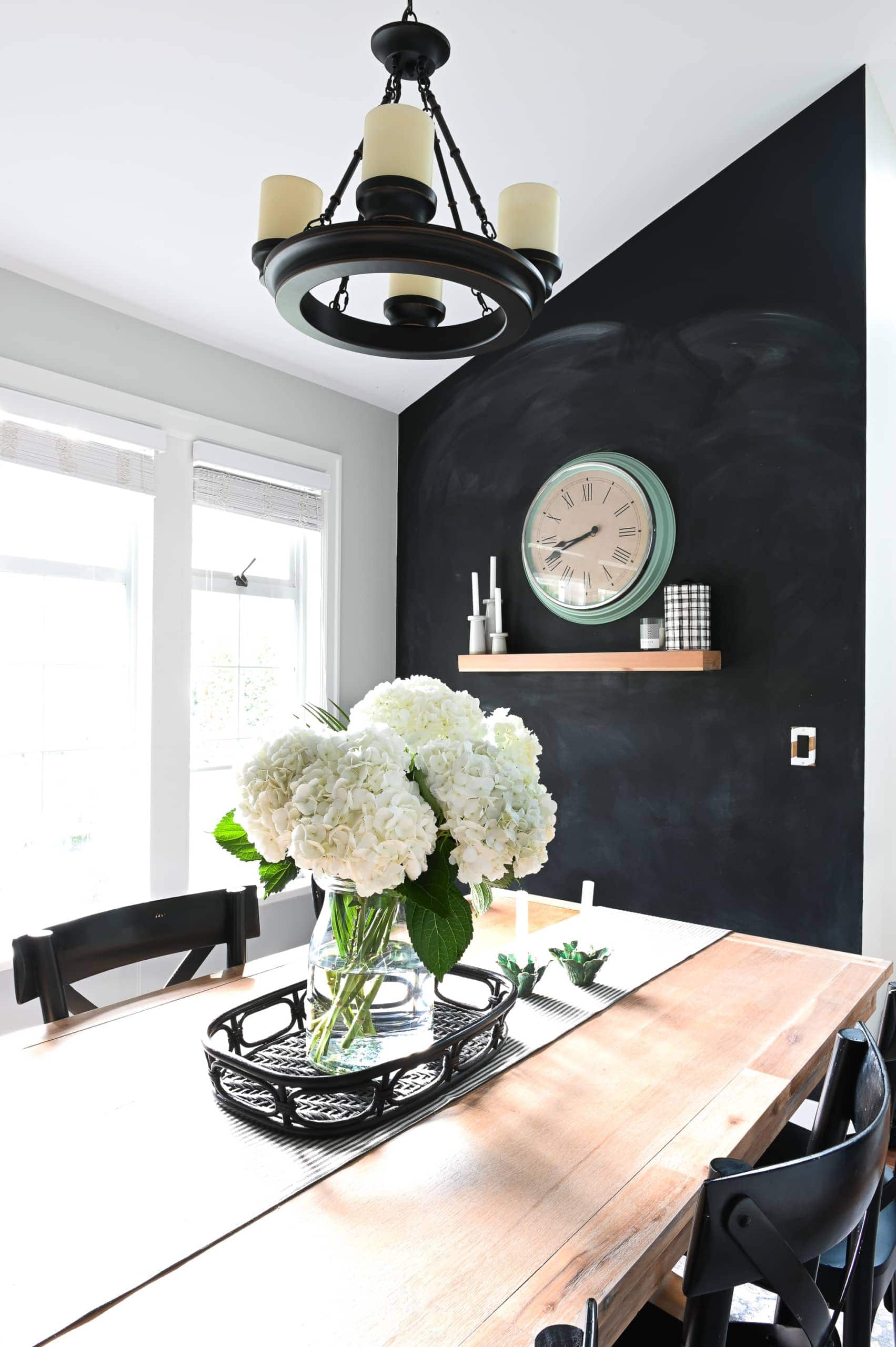 Black accent wall in dining room