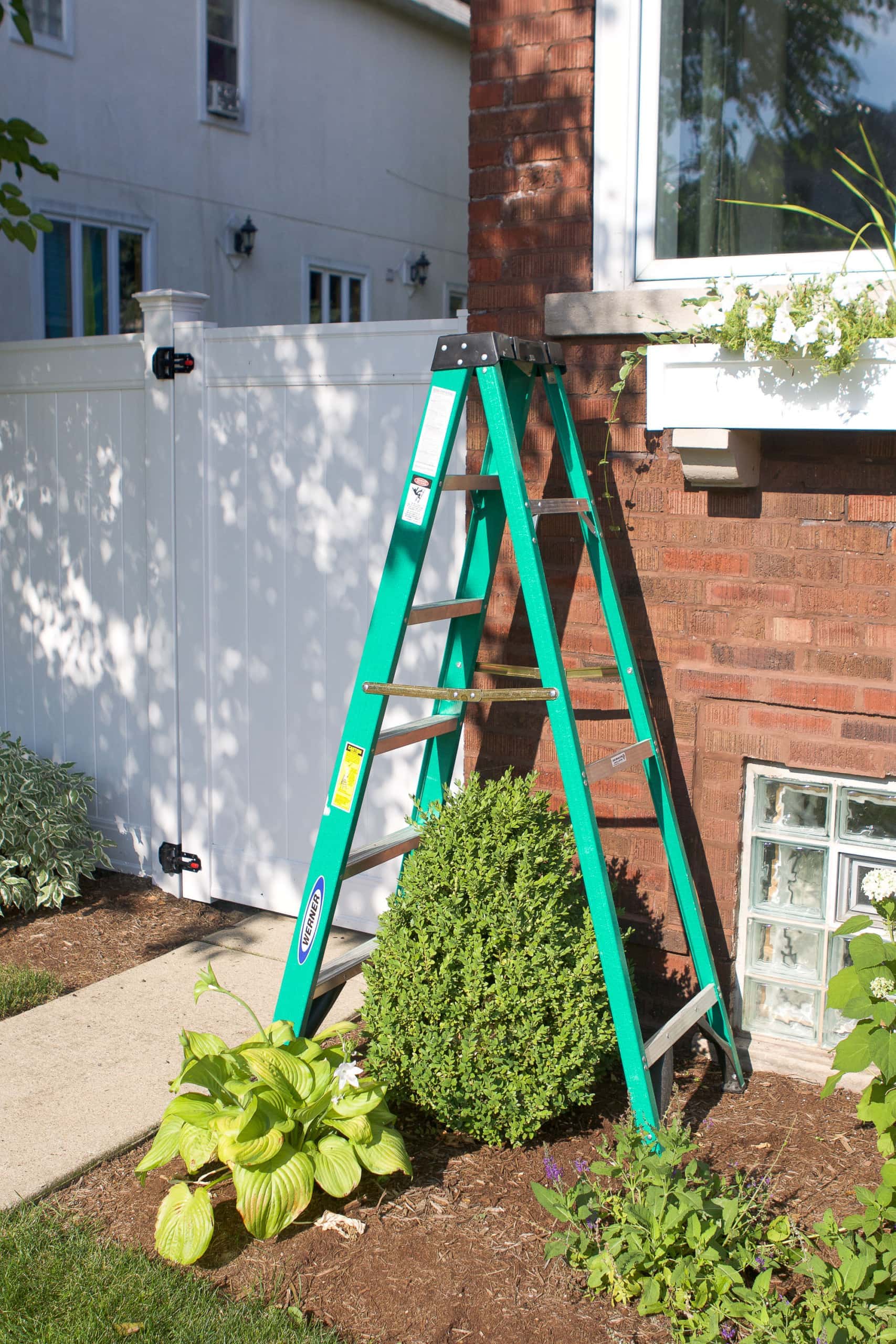 Use a ladder to paint the exterior of your home