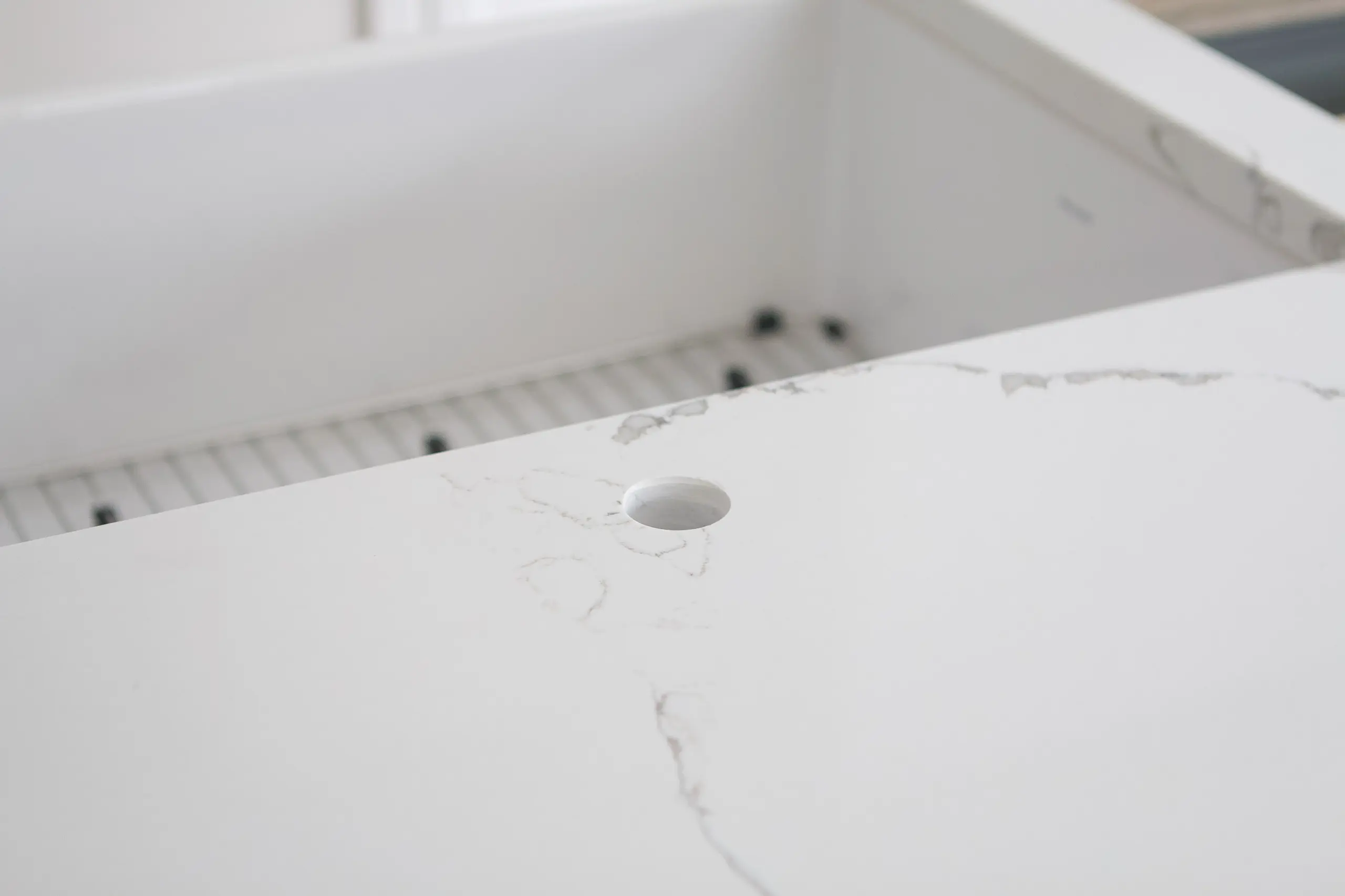 Cutting hole for faucet in quartz countertops
