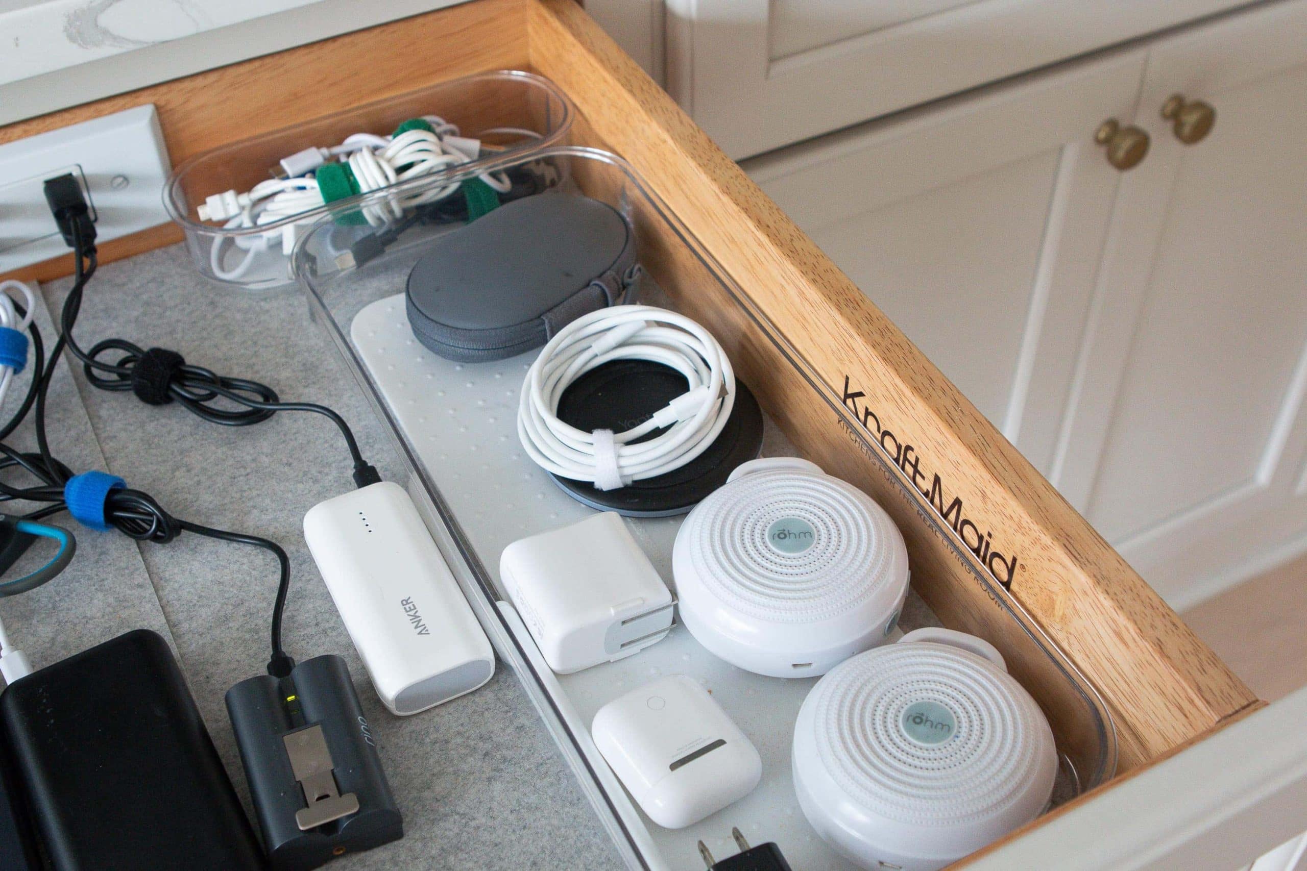 Add clear bins to your charging drawer to keep small items organized