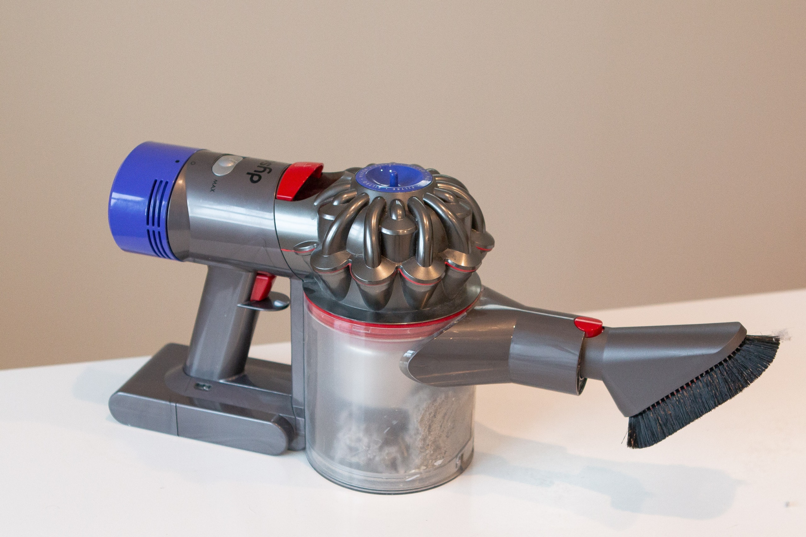 Dyson vacuum to get dust bunnies behind the bed